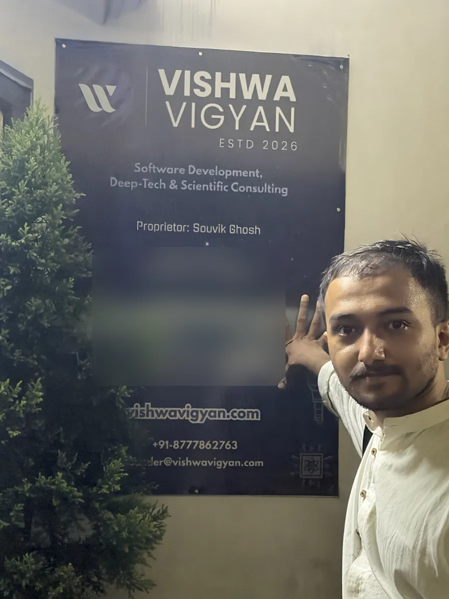 Souvik Ghosh beside the Vishwa Vigyan signboard, which reads: established 2026, software development, deep-tech and scientific consulting, proprietor Souvik Ghosh. The registration details are blurred.